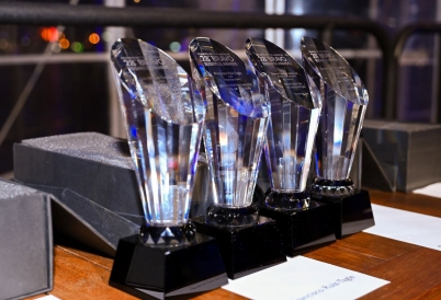 Four awards standing next to each other