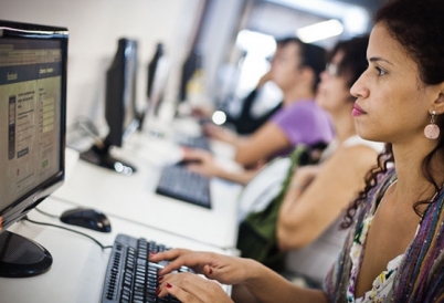 Woman types on computer.