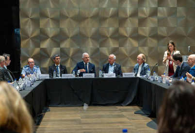 Multiple people seating at a table during the event