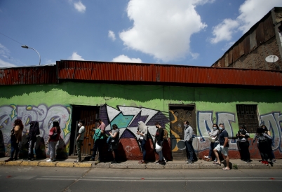 Chileans waiting to vote. 