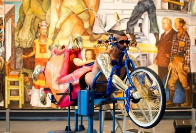The artist on a bike like sculpture