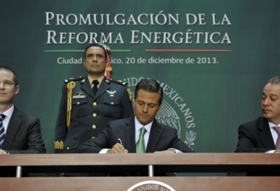 Mexico's President Enrique Peña Nieto signs energy reform law.