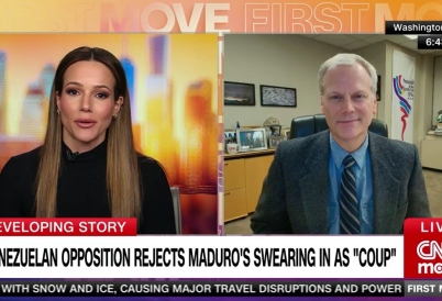 Eric Farnsworth on CNN with Isabel Rosales on screen