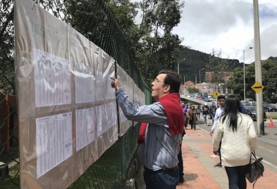 A Colombian voter checks the rolls in the Usaquén neighborhood of Bogotá on June 17.