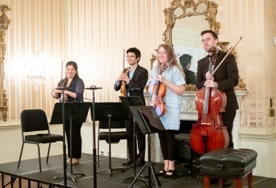 Momenta Quartet members standing on the stage