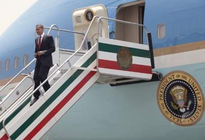 US President Barak Obama exits plane