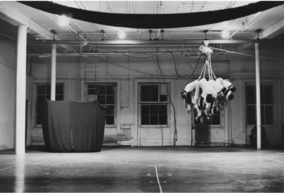 Slingshot, performed at Evening, Idea Warehouse, 1975. Gelatin silver print, 10 × 8 inches (25.4 × 20.3 cm). Sylvia Palacios Whitman Archive.