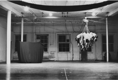 Slingshot, performed at Evening, Idea Warehouse, 1975. Gelatin silver print, 10 × 8 inches (25.4 × 20.3 cm). Sylvia Palacios Whitman Archive.