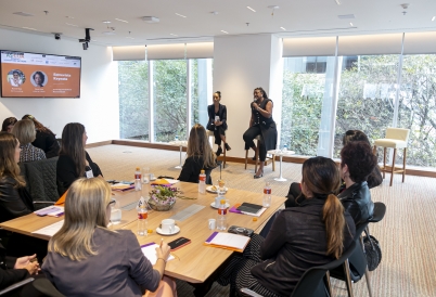 Rachel Maia and Flavia Lima speak with participants of Women's Hemispheric Network in São Paulo.