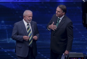 Lula da Silva (L) and Jair Bolsonaro face off at a debate. (AP)