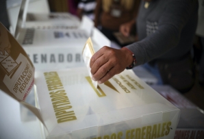 A voter casts a ballot in Mexico. (AP)