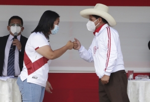 Keiko Fujimori and Pedro Castillo bump fists. (AP)