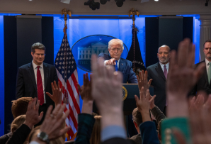 Trump pointing at a press conference.