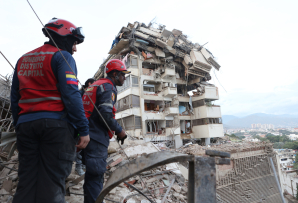 Rescue workers in Caracas. (AP)