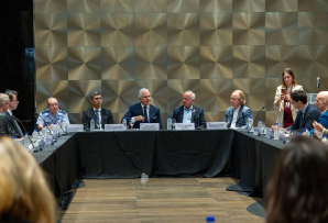 Multiple people seating at a table during the event