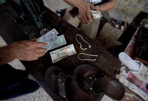 Money exchange at a small business in Cuba
