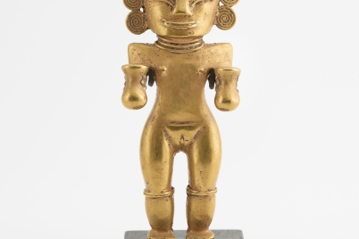 Female Figure Holding Poporos