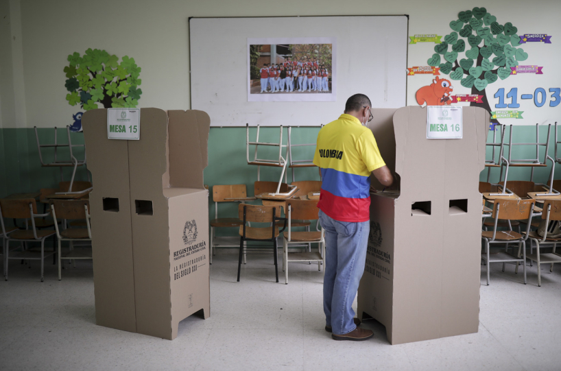 A voter at the polls in Colombia.