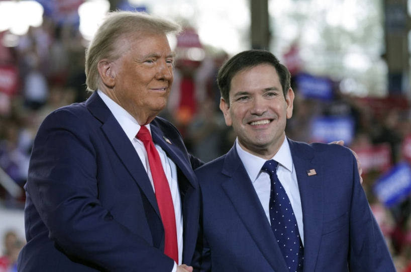 Donald Trump and Marco Rubio stand side by side, smiling.