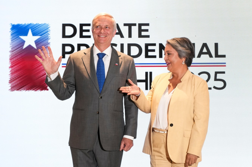 Candidates José Antonio Kast (L) and Jeannette Jara at a debate. (AP)