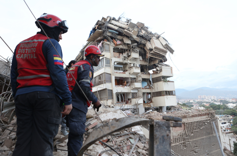 Rescue workers in Caracas. (AP)