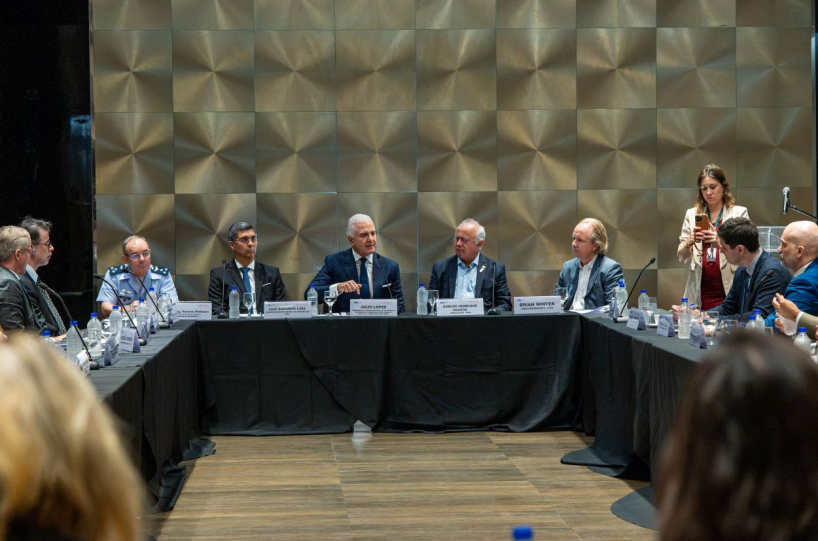 Multiple people seating at a table during the event