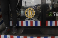 A merchant accepts Bitcoin in El Salvador. (AP)