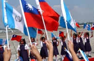 A group of children waving Guatemalan and Taiwanese flags. (AP)