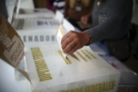 A voter casts a ballot in Mexico. (AP)