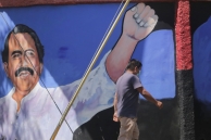 A man walks past a mural of Nicaragua's Daniel Ortega. (AP)