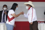 Keiko Fujimori and Pedro Castillo bump fists. (AP)