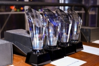 Four awards standing next to each other