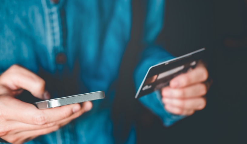 A smartphone user making a payment